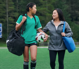 Mom and daughter with sports gear